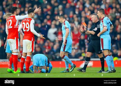 referee jonathan moss shows arsenals granit xhaka  red card