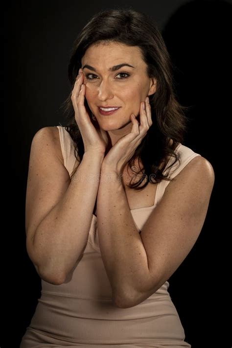 Beautiful Brunette Model Posing In A Studio Environment Stock Image