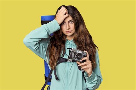 Premium Photo Caucasian Woman With Backpack And Vintage Camera Being