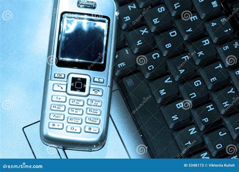 Mobile phone and computer stock image. Image of management - 3348173