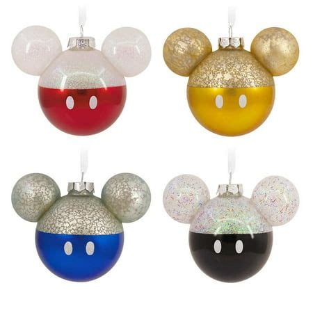 three mickey mouse ornament ornaments in different colors