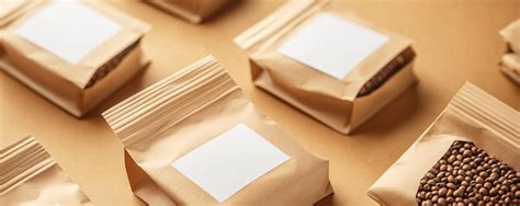 Coffee Beans Forming A Pattern In Kraft Paper Doypack Pouches With