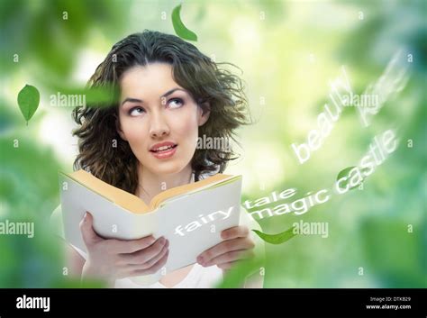 Young Beautiful Girl Reading A Magic Book Stock Photo Alamy