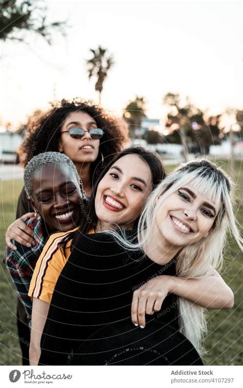 Multiethnic Group Of Female Hipsters Cuddling With Each One A Royalty