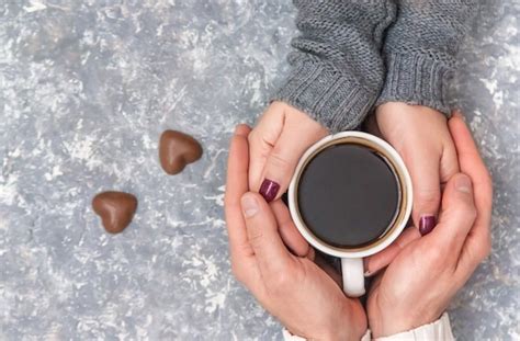 Premium Photo Male And Female Hands Holding Cups Of Coffee Selective