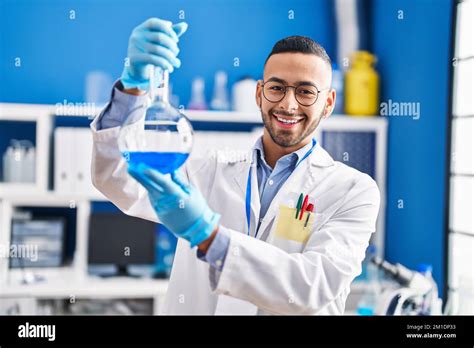 African American Man Scientist Smiling Confident Holding Test Tube At