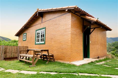 Small Brick Cottage In The Countryside In The Summertime Stock Photo