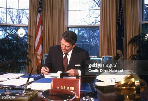 President Ronald Reagan working on economic report and legislative ...