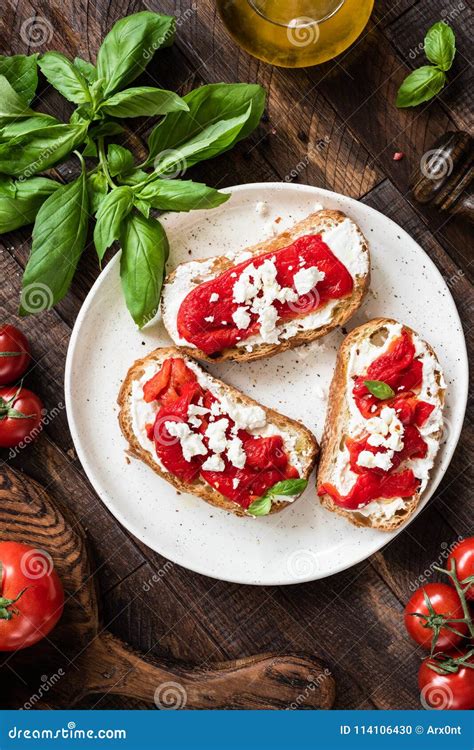 Italian Bruschetta With Roasted Pepper And Goat Cheese Table Top View