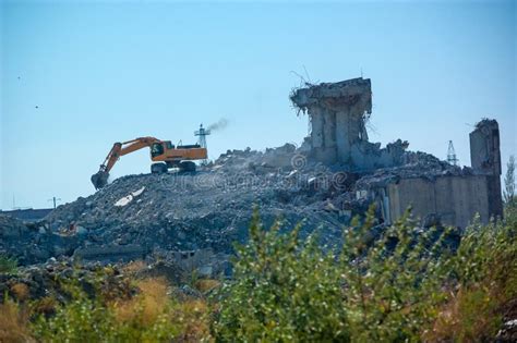 Excavator Demolishing an Old Building, the Demolition of the Building ...