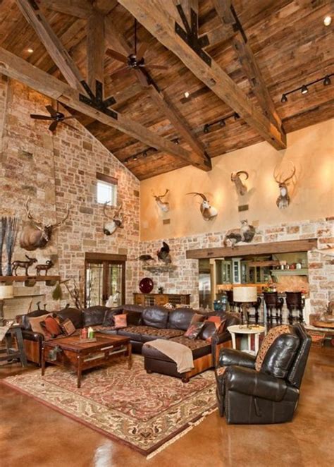 A Large Living Room Filled With Furniture And Deer Heads Mounted On The