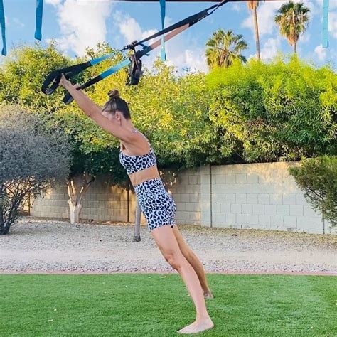 A Woman Doing Aerial Acrobatics In The Backyard