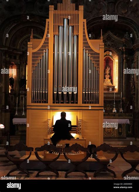 Man playing pipe organ in a church Stock Photo - Alamy