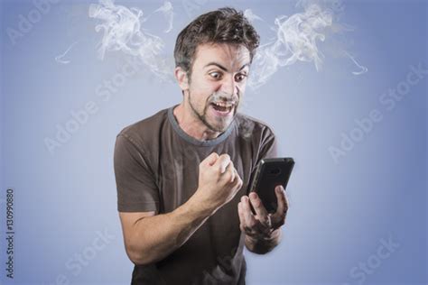 Angry Man Shouting At His Cell Phone Smoking With Rage Smoke Coming