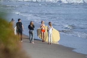 Amber Valletta Poses In A Bikini With A Big Umbrella In The Shores On The Beach In Malibu AZNude