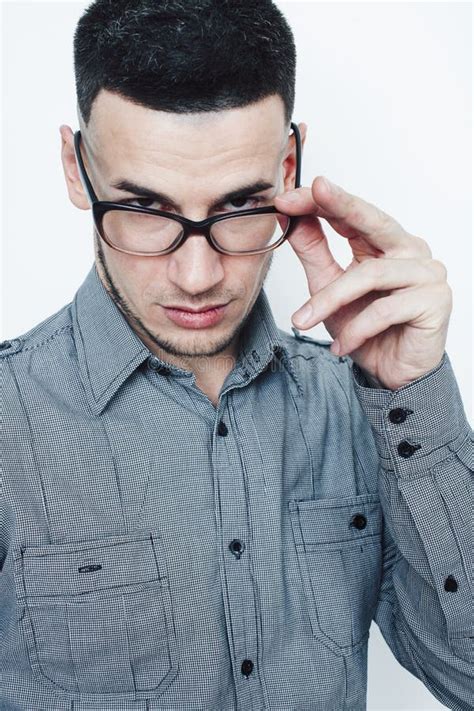 Young Handsome Teenage Hipster Guy Posing Emotional Wearing Glasses