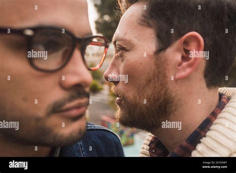 Close Up Of Thoughtful Gay Couple Looking Away Stock Photo Alamy