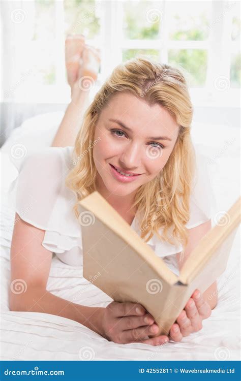 Pretty Blonde Lying On Bed Smiling At Camera With Book Stock Image Image Of Spare Lying