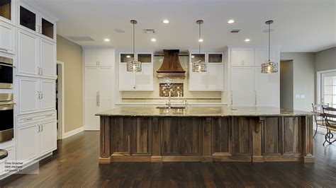 White Cabinets With A Walnut Kitchen Island Omega