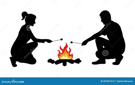 Silhouette Of Man With Woman Frying Marshmallow On Bonfire Camping