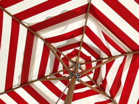 Premium Photo Low Angle View Of Red And White Striped Umbrella