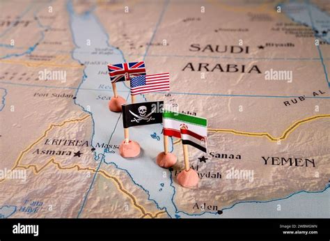 Flags Of USA UK Iran And Yemen Surrounding The Skull And Crossbones