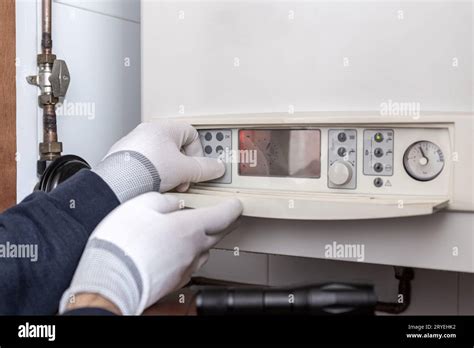 Technician Servicing Heating Boiler In A House Stock Photo Alamy