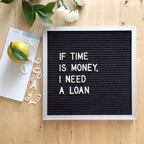 A Sign That Says If Time Is Money I Need A Loan Next To Some Flowers