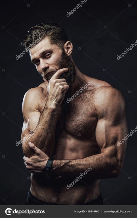 Bearded Guy With Naked Torso Posing With Hand Under Chin Stock Photo