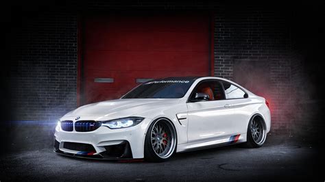 A Beautiful White Bmw F82 M4 In A Garage Wallpaper Download 5120x2880