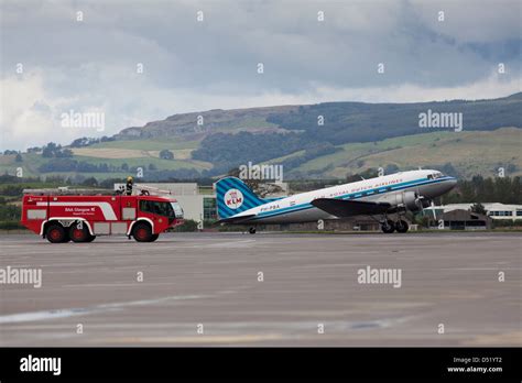 A Klm Royal Dutch Airline Twin Prop Aircraft Flying Out Of A Scottish