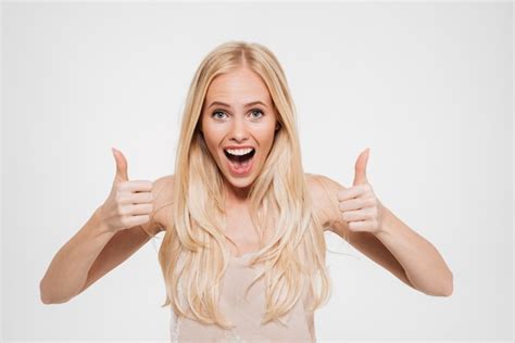 Portrait Of A Happy Excited Woman Showing Thumbs Up Free Photo