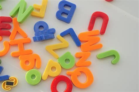 Premium Photo Colorful Plastic Letters On White Background Close Up