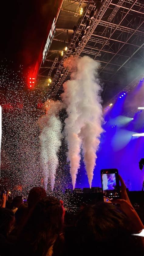 People Are Taking Pictures With Their Cell Phones As Fireworks Go Off