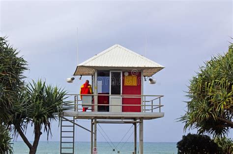 Australian Surf Life Saver Looking At Seascape From To Of A Watchtower