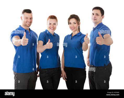 Portrait Of Happy Janitors Showing Thumb Up Sign Against White