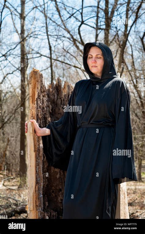 Hooded Woman In Black Robes Deep In The Forest Witches Halloween And