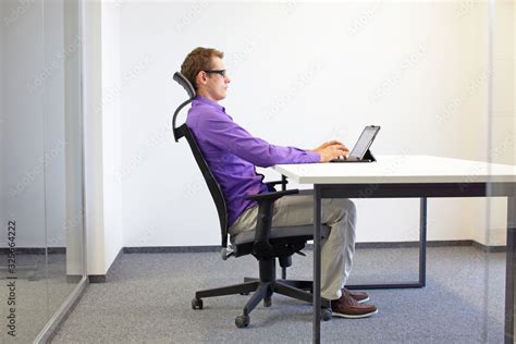 Correct Sitting Position At The Office Desk Man On Chair Working With