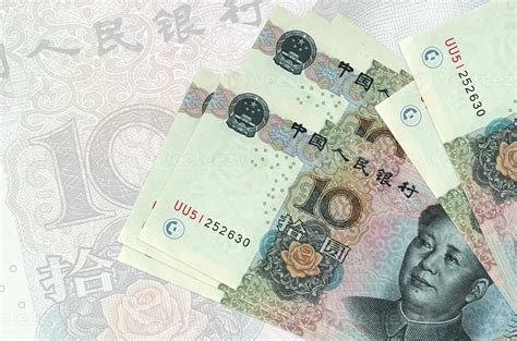 Chinese Yuan Bills Lies In Stack On Background Of Big Semi