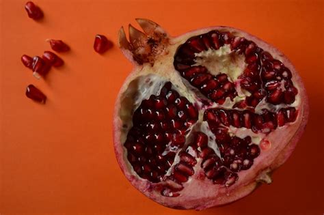 Premium Photo Fresh Sliced Pomegranates Half Pomegranate And