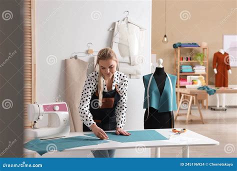 Dressmaker Marking Fabric With Chalk In Workshop Stock Photo Image Of