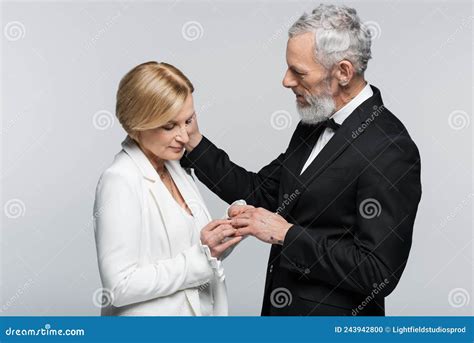Mature Groom Touching Bride With Wedding Stock Photo Image Of Blonde