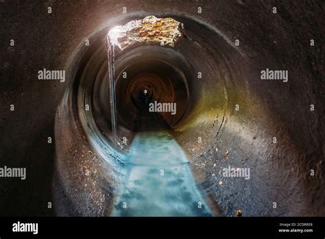 Industrial Wastewater And Urban Sewage Flowing Through Round Sewer Pipe