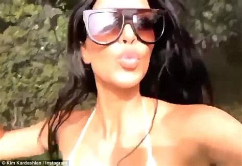 Kim Kardashian Reveals Her Killer Curves In Skimpy Neon Bikini As She Bounces On Backyard