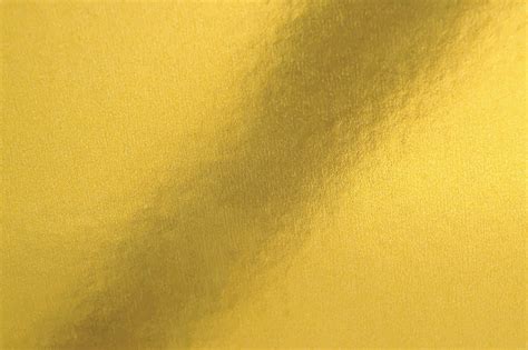 Gold Texture Background In Bright Light Shiny Luxury Gold Color