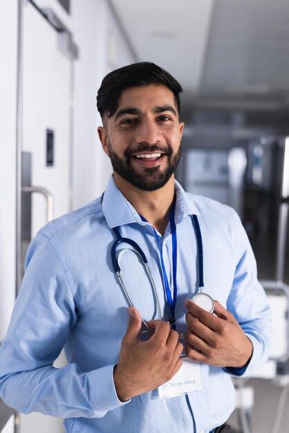 Premium Photo Portrait Of Happy Biracial Male Doctor With Stethoscope