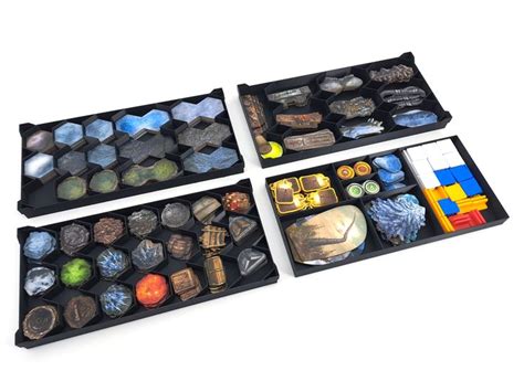 Three Black Trays Filled With Different Types Of Items