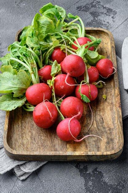 Premium Photo | Small garden radish on gray stone background