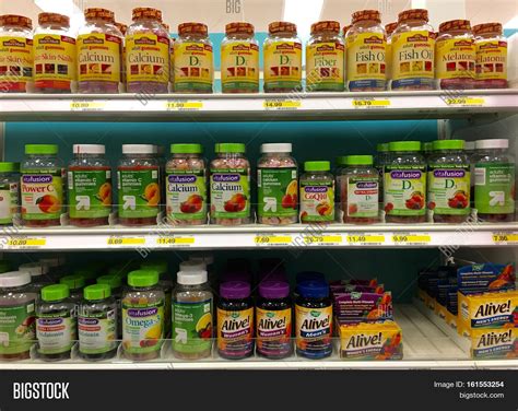 Alameda CA - April 08 2016: Store shelf display multiple brands variety vitamins and supplements ...