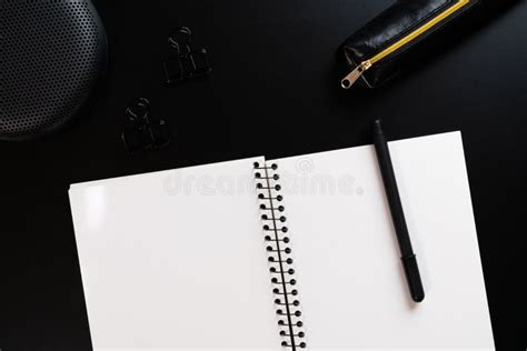 Black Style Set Notepad Pen And Paper Clips On Black Background Stock